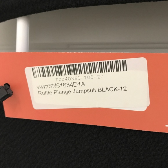 Ruffle Plunge One-Piece Jumpsuit - Picture 9 of 10